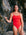 Ski paddler Jenaya Massie leaning against a rock at the beach wearing the JAYD Swimwear Airlie one piece 
