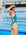 JAYD model Adri looking over her shoulder wearing the Albi one piece swimsuit in cove green with pink straps.
