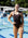 Athlete Emily wears JAYD Swimwear's athletic, chlorine resistant one piece called Finley. This piece offers slim coverage and is built for performance. She is wearing the colour Cacao.