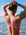 JAYD Swimwear model wearing the Finley fixed back one piece swimsuit in Fiesta, with contrasting fairy floss pink double straps, designed to stay put through every lap and wave.