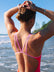 JAYD Swimwear model wearing the Finley fixed back one piece swimsuit in Fiesta, with contrasting fairy floss pink double straps, designed to stay put through every lap and wave.