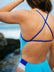 JAYD Swimwear model wearing the full coverage Mykonos blue Ibiza one piece swimsuit with contrasting cobalt semi-adjustable back and shoulder straps.