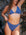 JAYD model wearing the Storm blue Tahiti Bikini Bottom against a rocky background